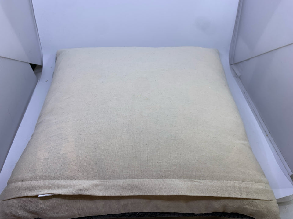 DARK GREY PILLOW W/ EMBOSSED MEDALLION DESIGN.