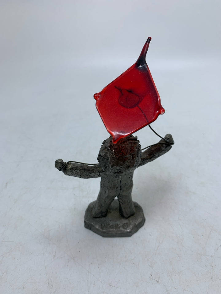 BOY FLYING A KITE FIGURINE.