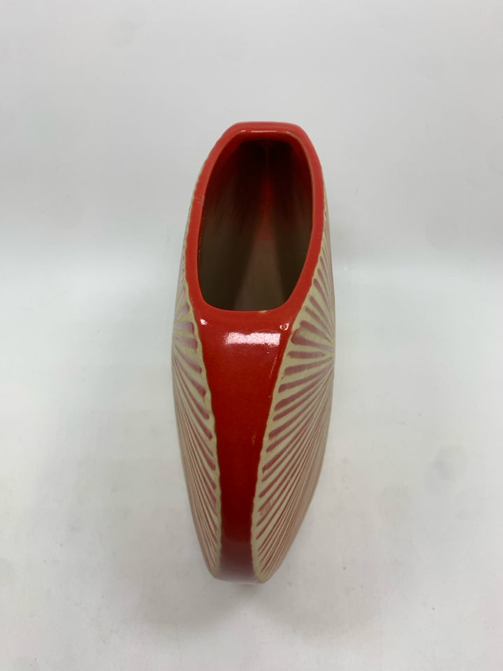 THIN RED VASE W/SUN PATTERN.