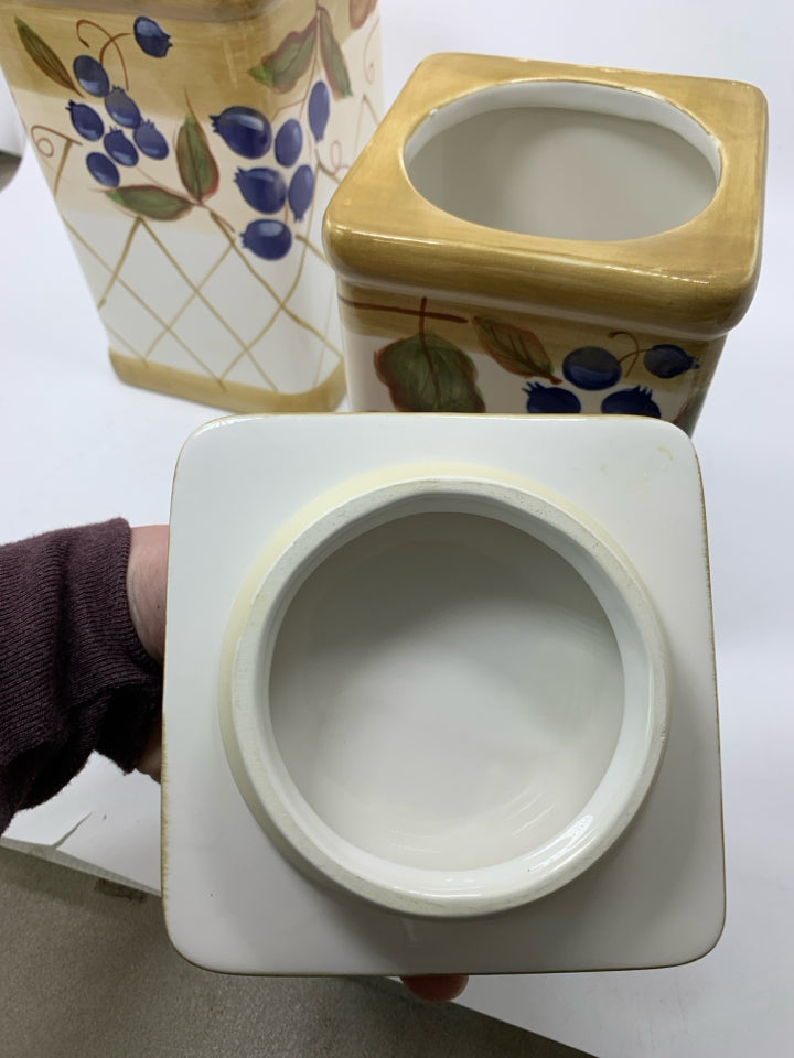 2 CERAMIC SQUARE CANISTERS W/ BLUEBERRIES & ACORNS.
