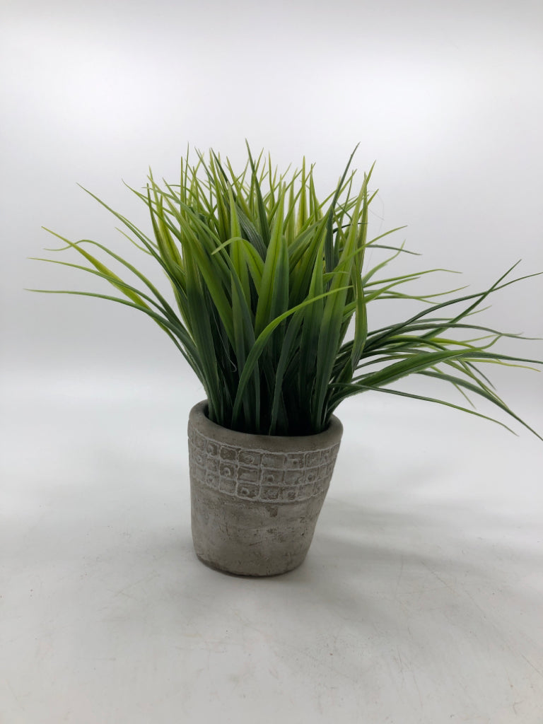 SM FAUX GRASS IN STONEWARE PLANTER.