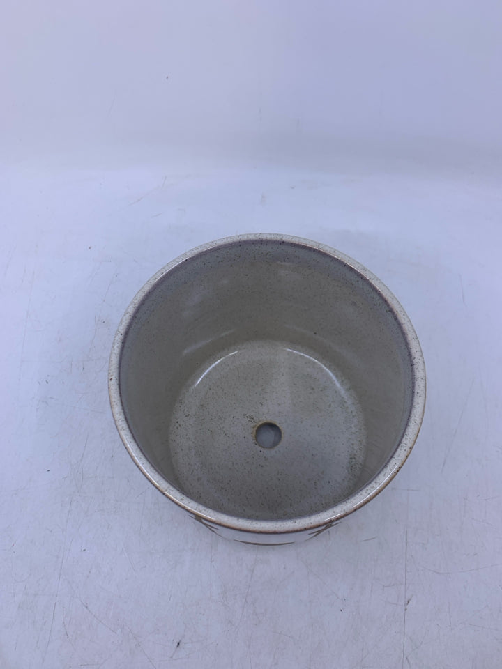 TAN W/ WHITE GLASS CIRCLE DESIGNS.