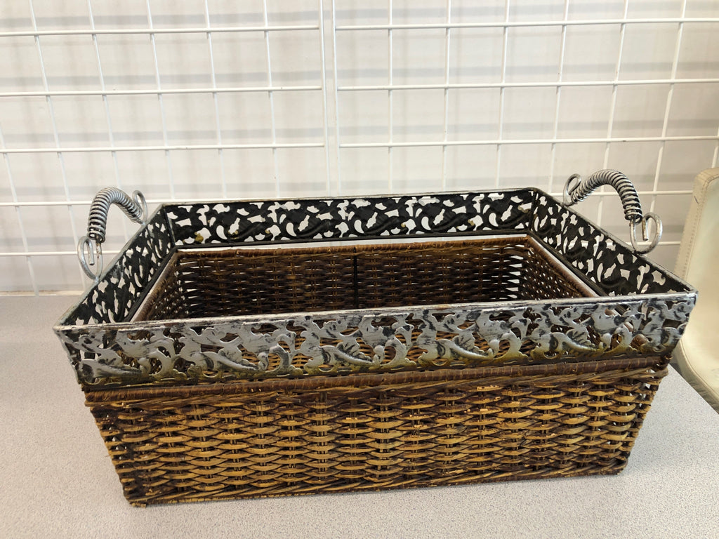BROWN WOVEN BASKET W/METAL FLORAL RIM AND HANDLES.