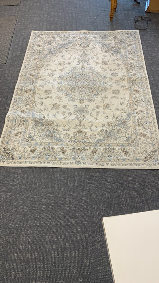 CREAM AREA RUG W/ BLUE,BROWN,GREY PAISLEY DESIGN EDEN.