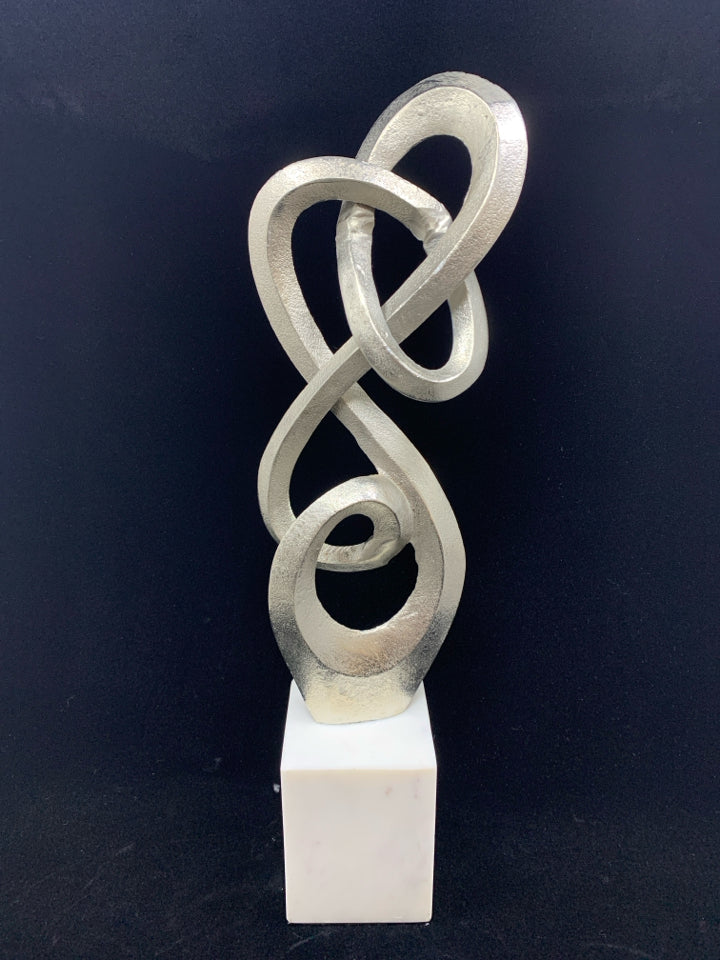 ABSTRACT METAL SCULPTURE ON MARBLE BASE.