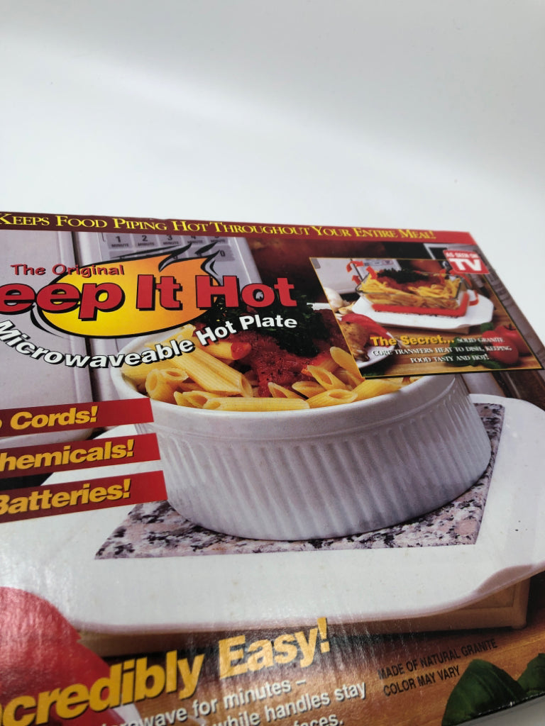 NIB MICROWAVEABLE HOT PLATE.