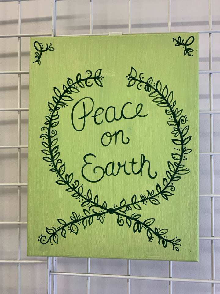 GREEN CANVAS PEACE ON EARTH WALL DECOR.