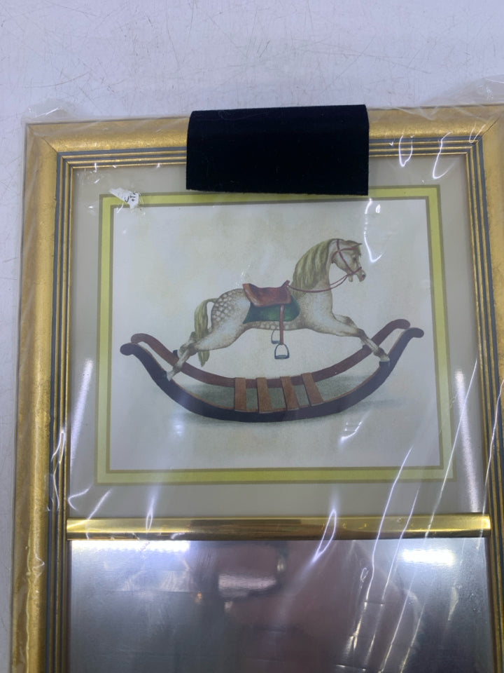 WHITE ROCKING HORSE TOP W/ MIRROR RECTANGLE GOLD FRAME.