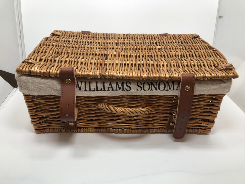 WOVEN BASKET W/FABRIC LINER AND FAUX LEATHER BUCKLES.