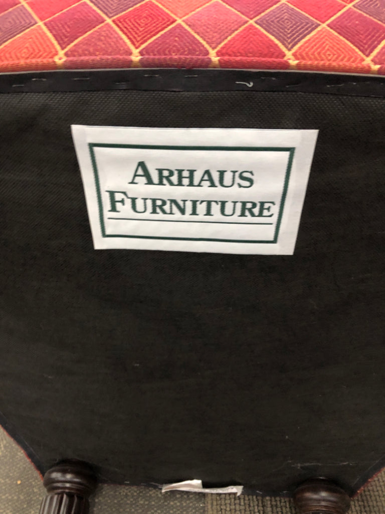 MULTI COLORED PRISM PATTERN FABRIC ACCENT CHAIR.