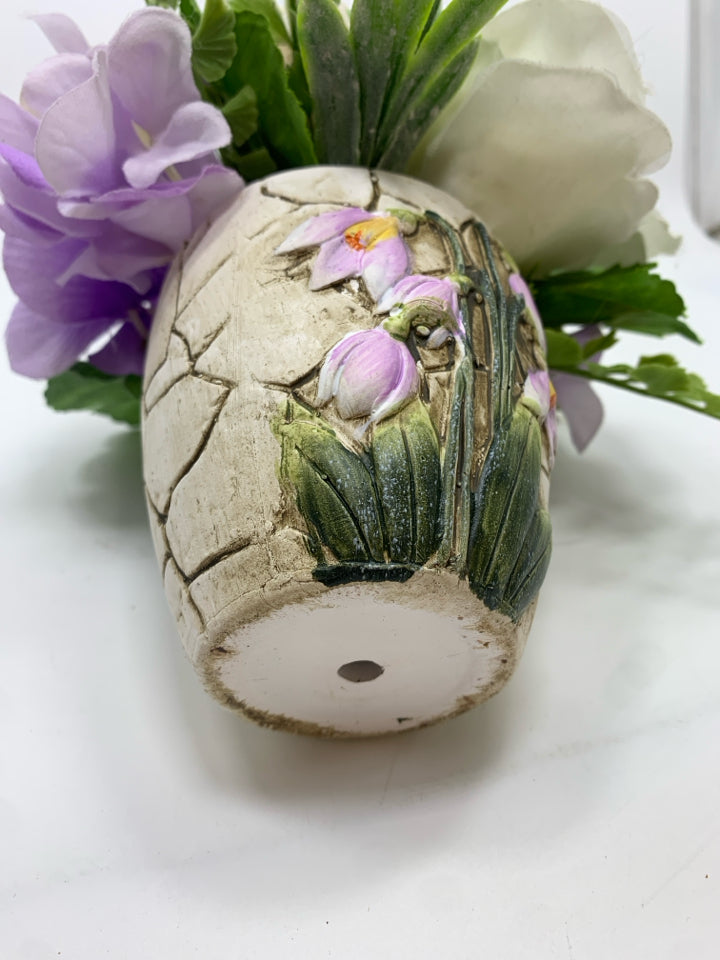 FAUX WHITE ROSES IN CRACKLE CERAMIC POT.