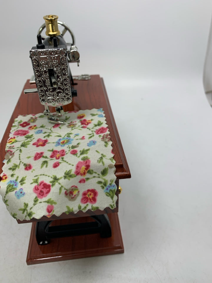 PLASTIC SEWING TABLE W/ MACHINE MUSIC BOX MOVING PIECES.
