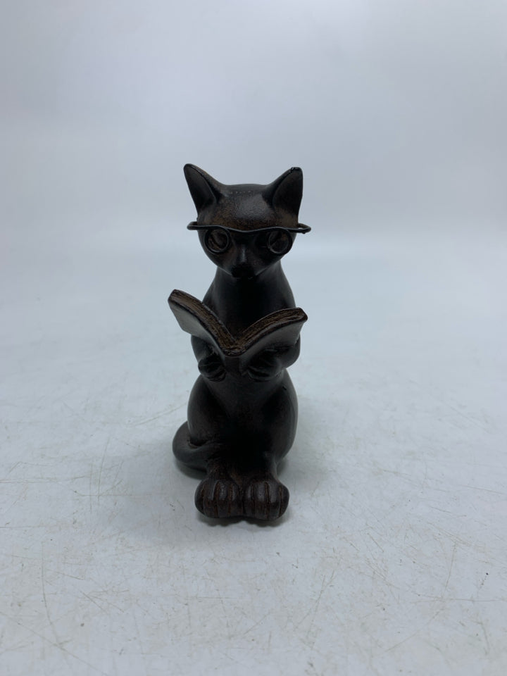 BROWN RESIN CAT READING.
