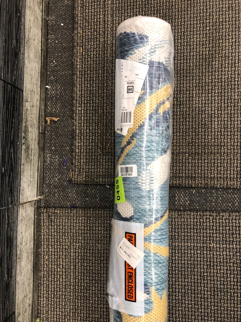 NIP BLUE AND YELLOW BANANA LEAF OUTDOOR RUG.