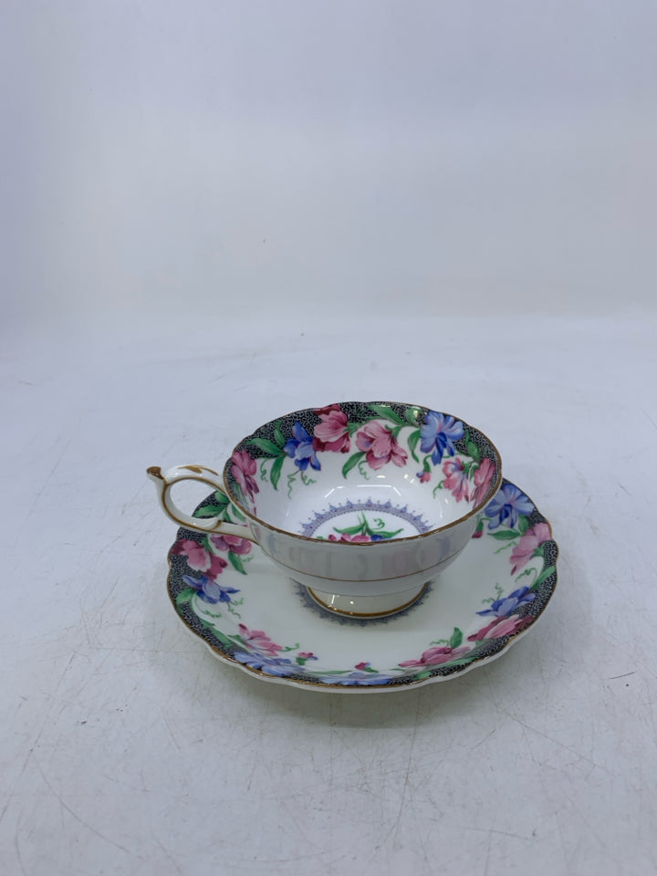 BLUE,PINK FLOWERS W/ BLACK EDGE.