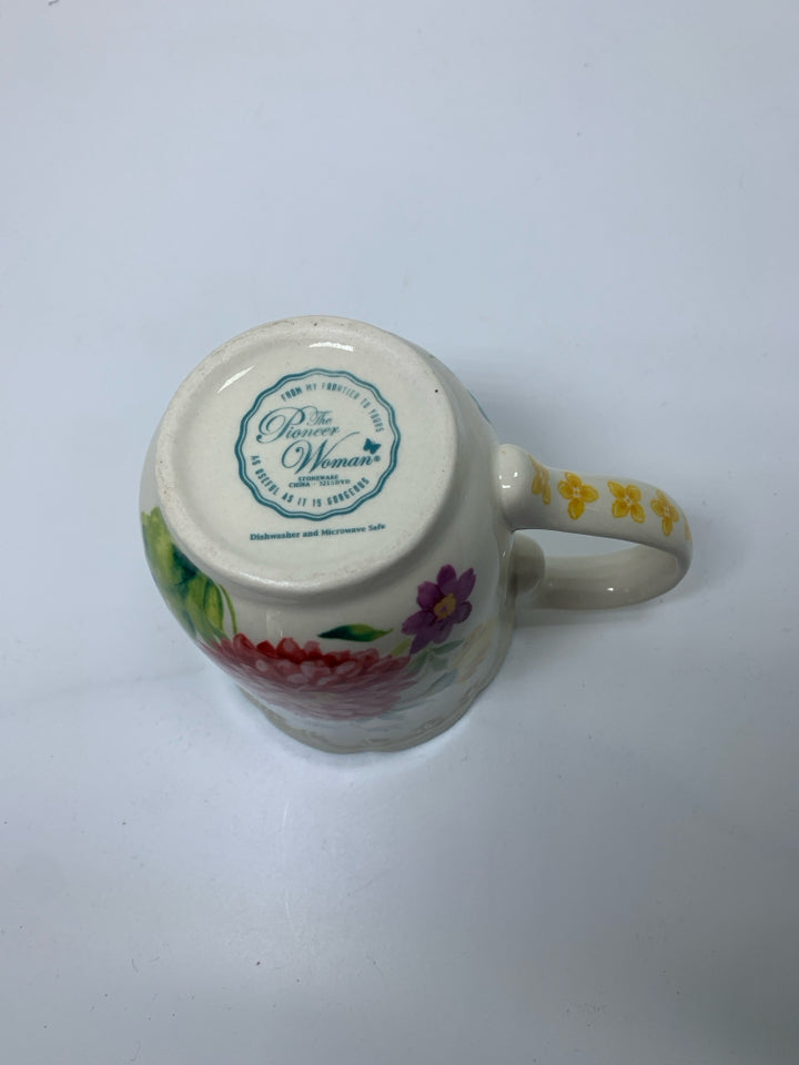 FLORAL MUG W/ BLUE SCALLOP EDGE.