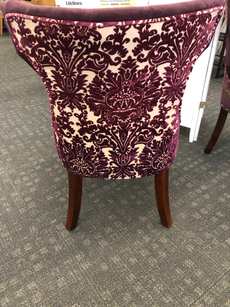 2 MAROON SUEDED CHAIRS W/PAISLEY DESIGN ON BACK & WOOD LEGS.