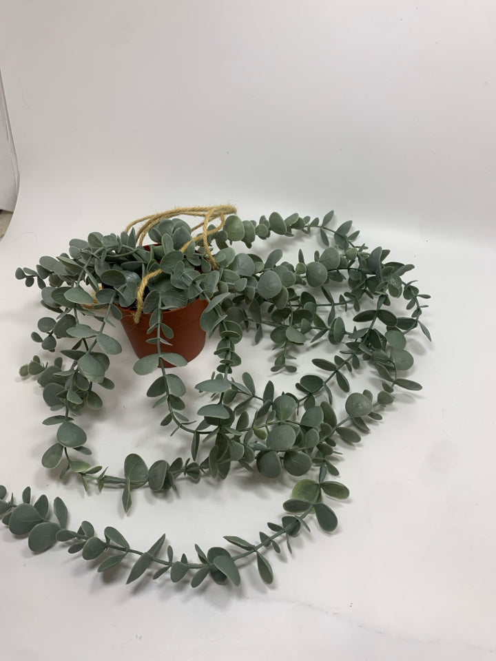 FAUX EUCALYPTUS IN HANGING PLASTIC POT.