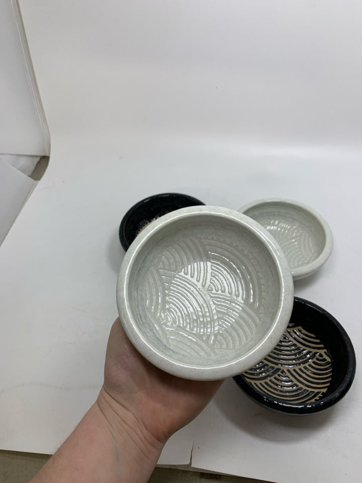 4 BLACK & WHITE BERRY BOWLS W/ DETAILED LINED BOTTOMS.