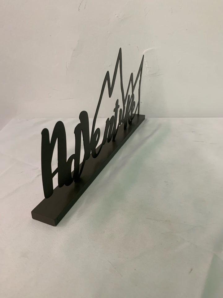 BROWN METAL STANDING ADVENTURE SIGN.