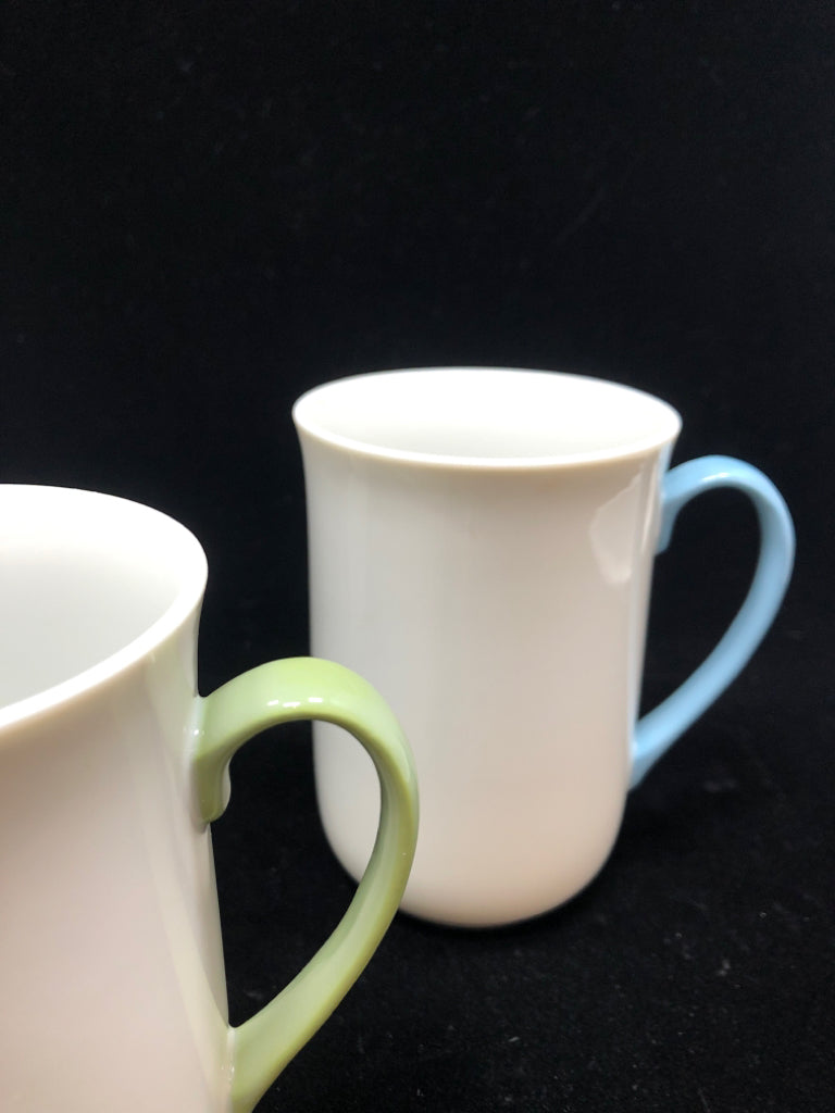 4 WHITE MUGS W/MULTI COLORED HANDLES.