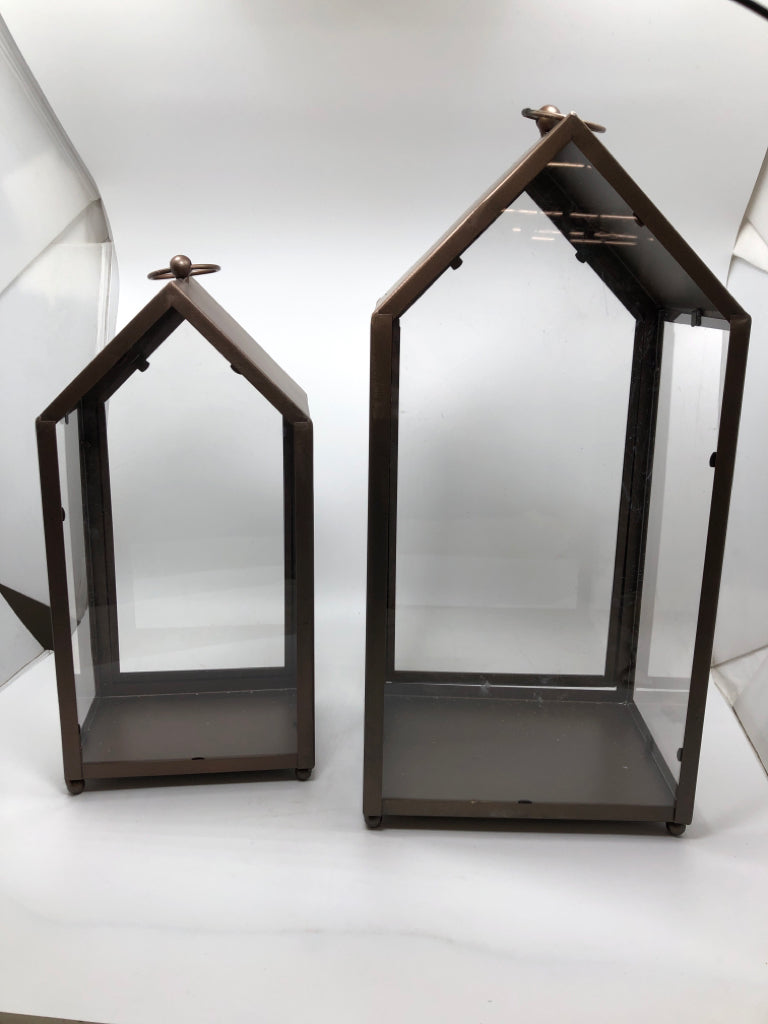 2 BROWN METAL CANDLE LANTERNS.