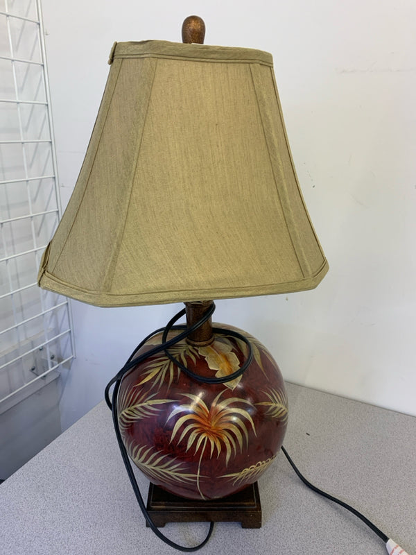 MAROON TROPICAL PALM ROUND GLASS TABLE LAMP WITH GOLD SHADE.