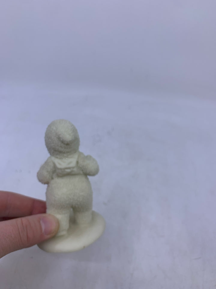 SNOW BABY HOLDING ACCORDION WALKING.