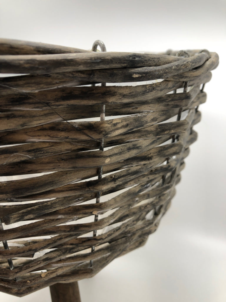 GRAY DISTRESSED RAISED WICKER PLANTER.