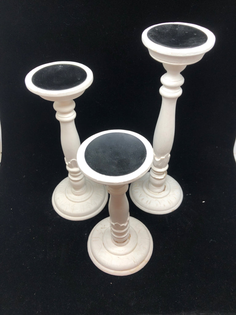 3 DISTRESSED WOODEN CANDLE STICK HOLDERS.