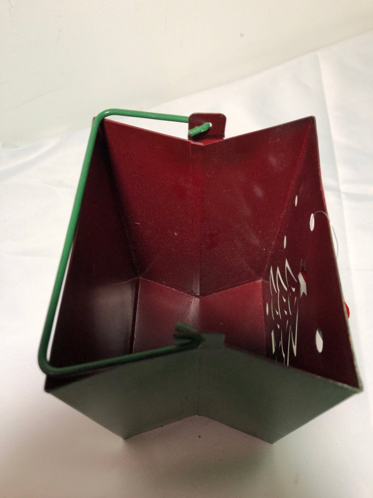 GREEN METAL PIERCED BAG CANDLE HOLDER W HANDLES.
