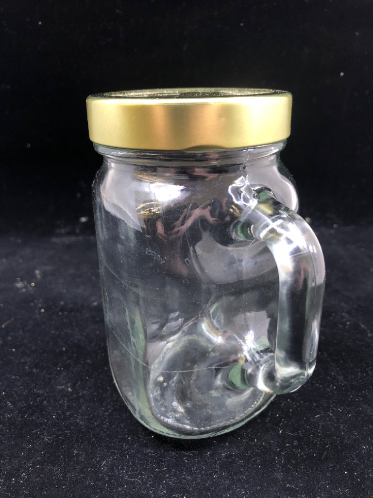 JAR STYLE MUG W HANDLE AND GOLD LID.