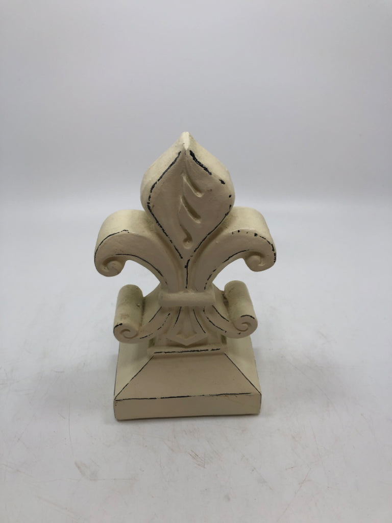 WHITE FLEUR-DE-LIS FIGURINE.