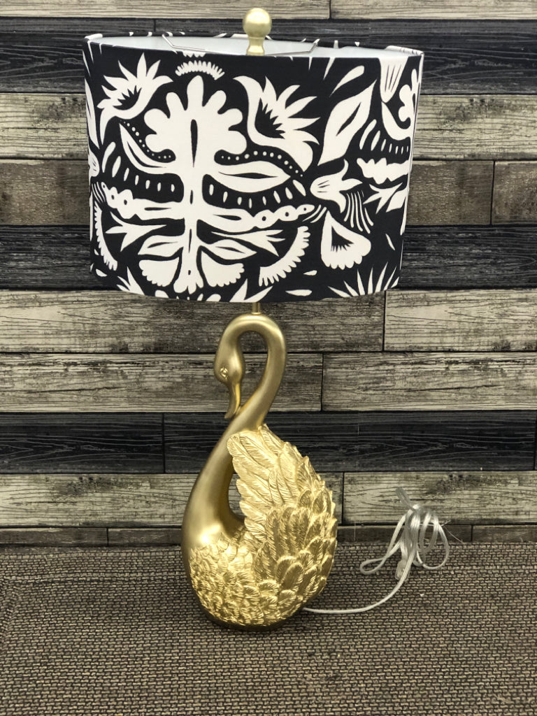 GOLD SWAN BASE LAMP, BLACK AND WHITE SHADE.