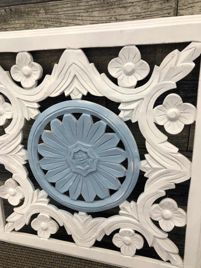 WHITE WOODEN FLORAL WALL HANGING W/BLUE MEDALLION.