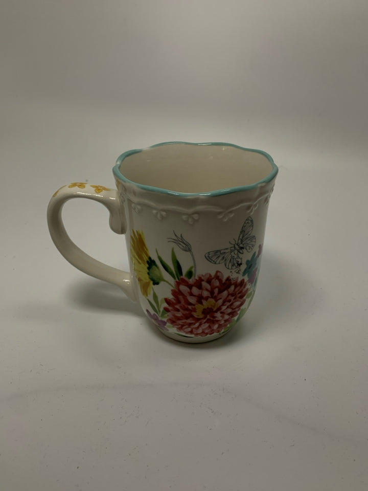 FLORAL MUG W/ BLUE SCALLOP EDGE.