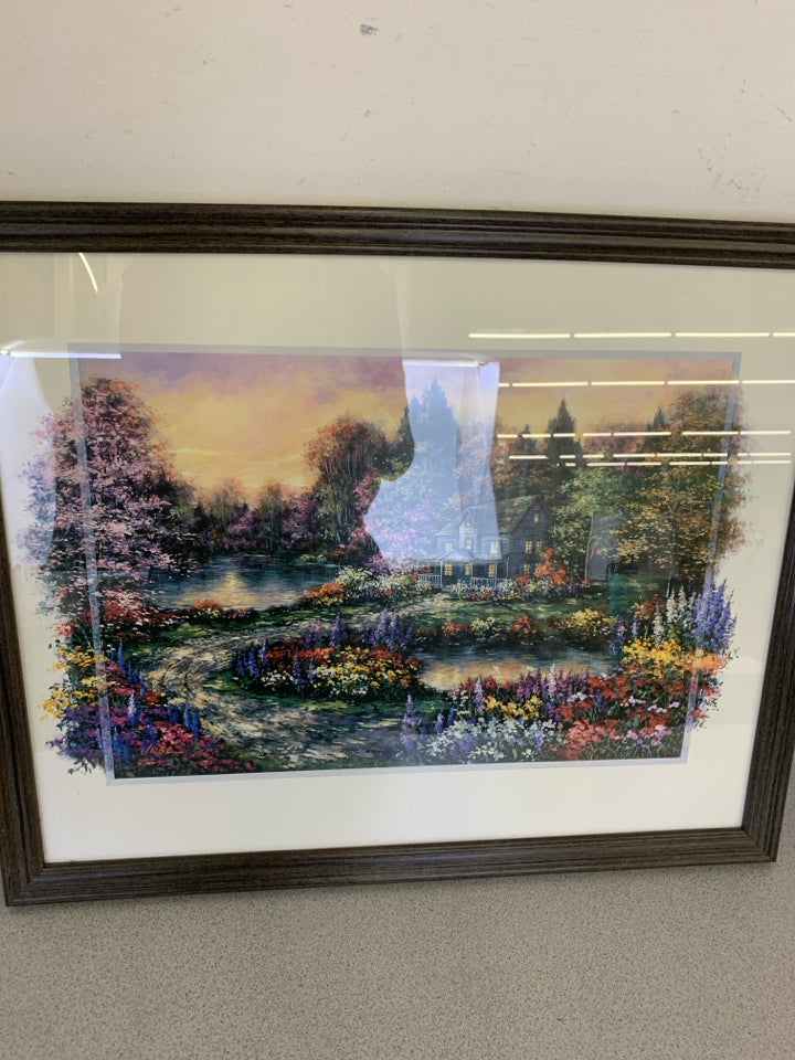 COLORFUL FLORAL COTTAGE SCENE IN DARK FRAME.