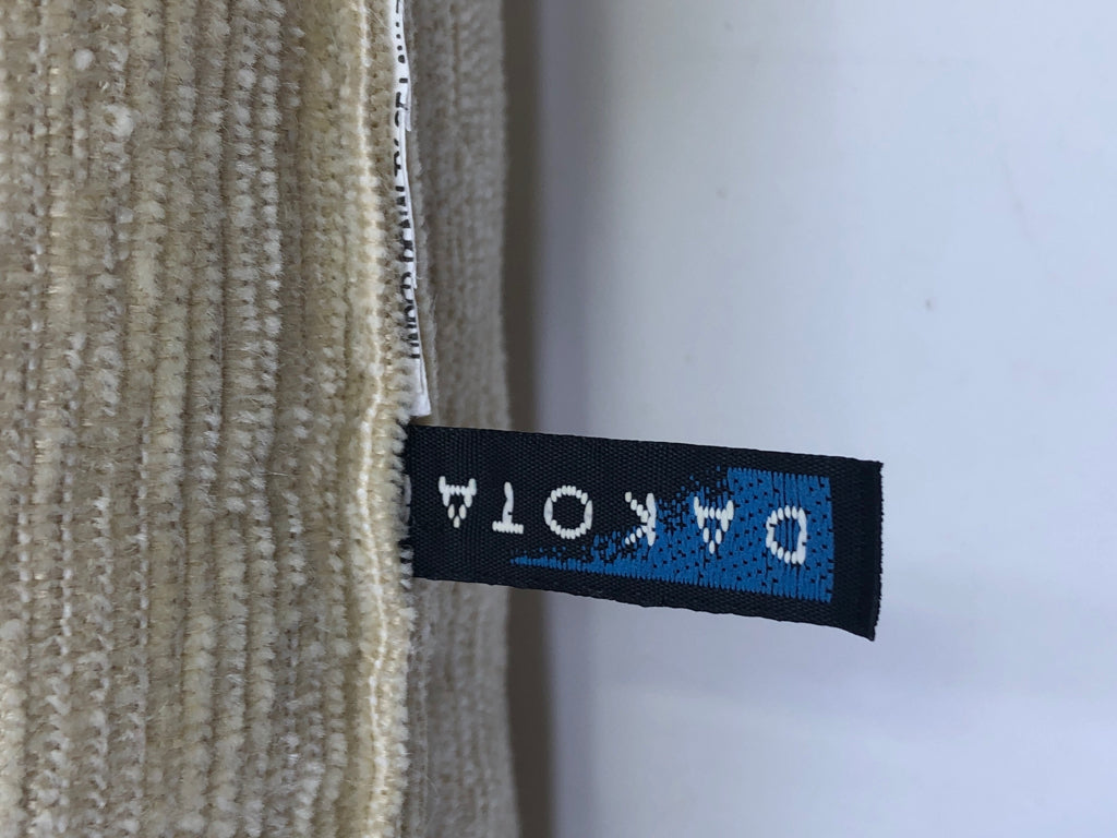 TAN RECTANGLE PILLOW W TASSLES.