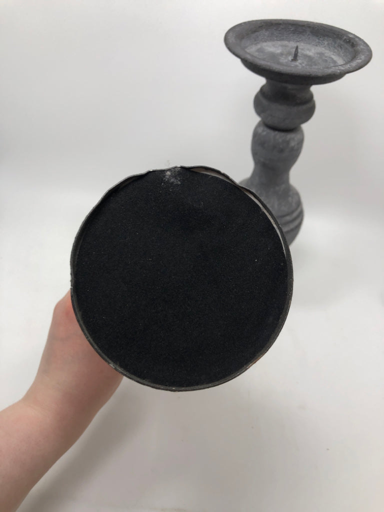 2 GREY METAL CANDLESTICK HOLDERS.