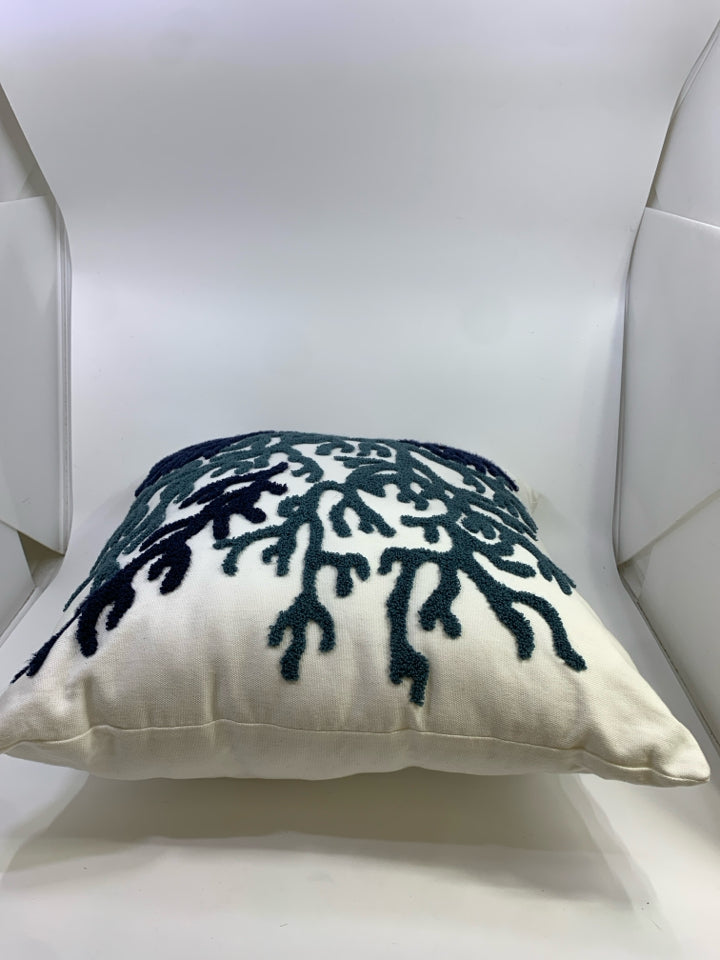 WHITE ACCENT PILLOW W/NAVY CORAL DESIGN.
