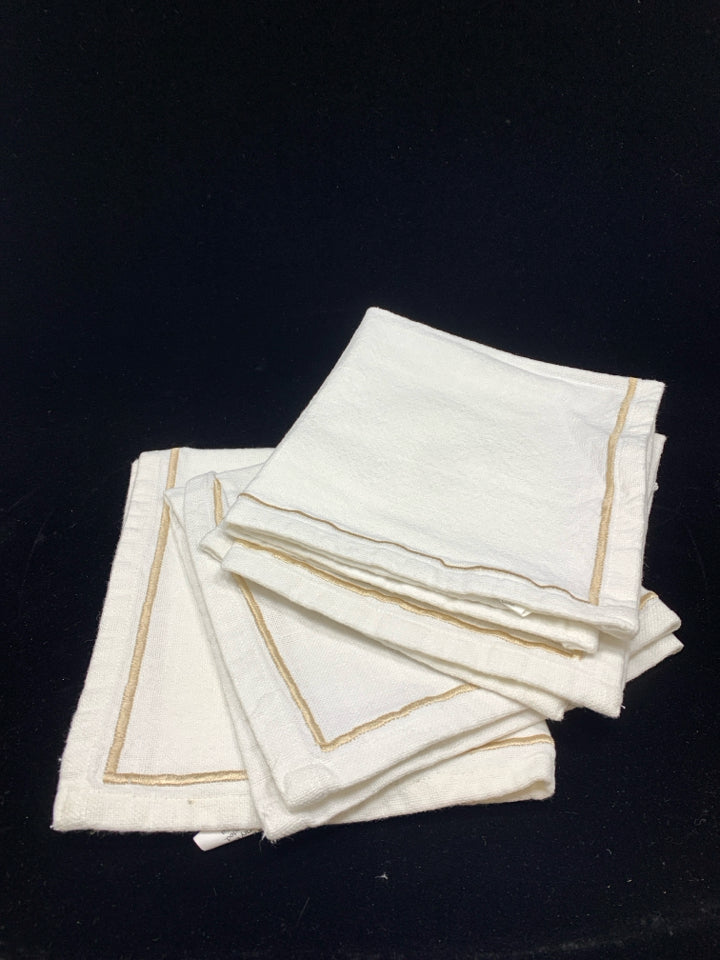 4 WHITE W/TAN EMBROIDERY NAPKINS.