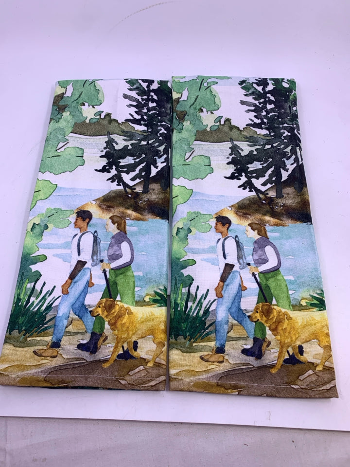 2 TEA TOWELS COUPLE WALKING DOG ON HIKE.