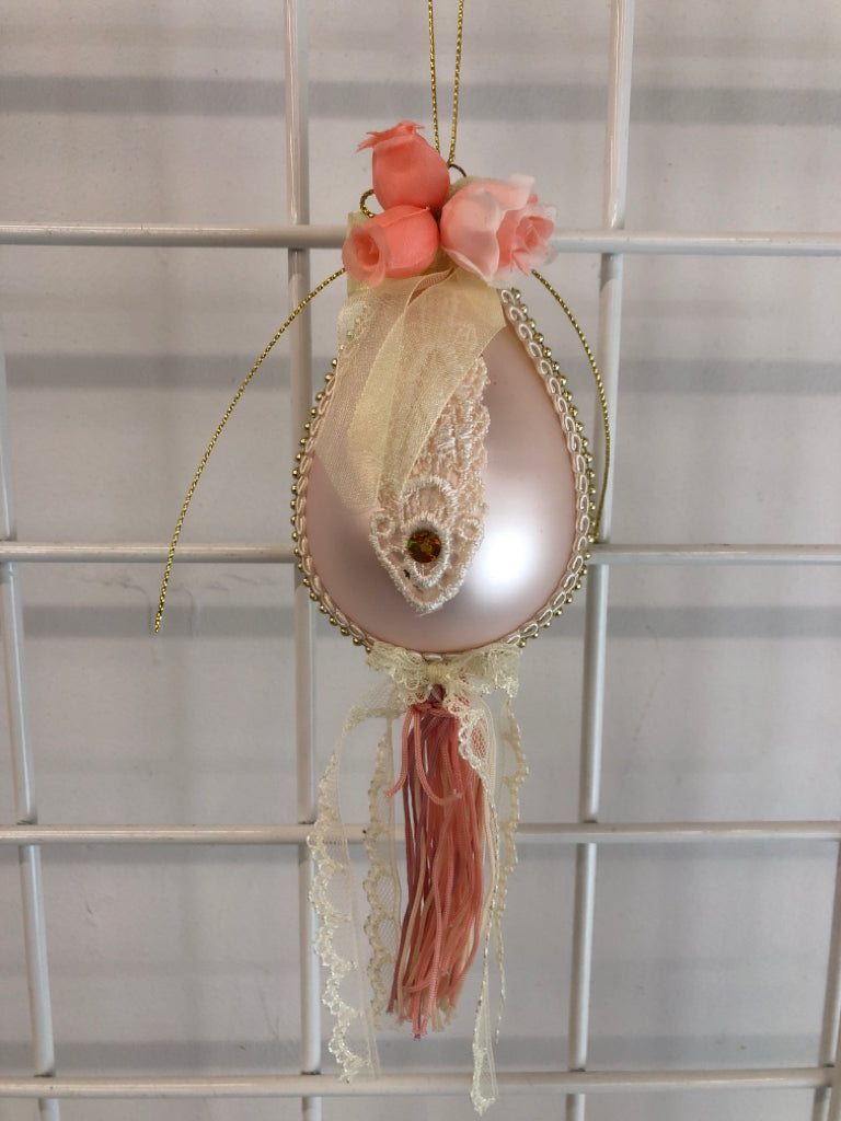 LACE PINK BULB ORNAMENT W/COLORFUL TASSELS.