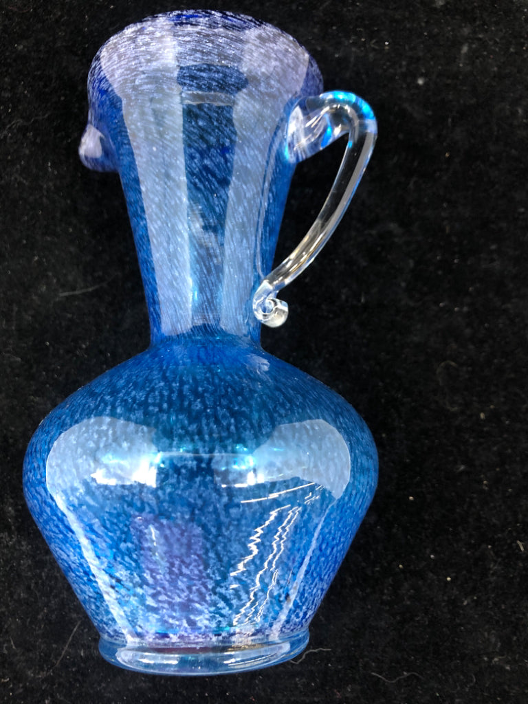 BLUE BLOWN GLASS PITCHER W/ CLEAR GLASS HANDLE.