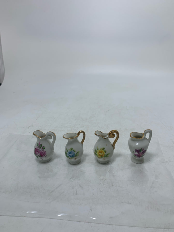 4 MINI PITCHERS W/ ASSORTED FLOWERS IN BAG.