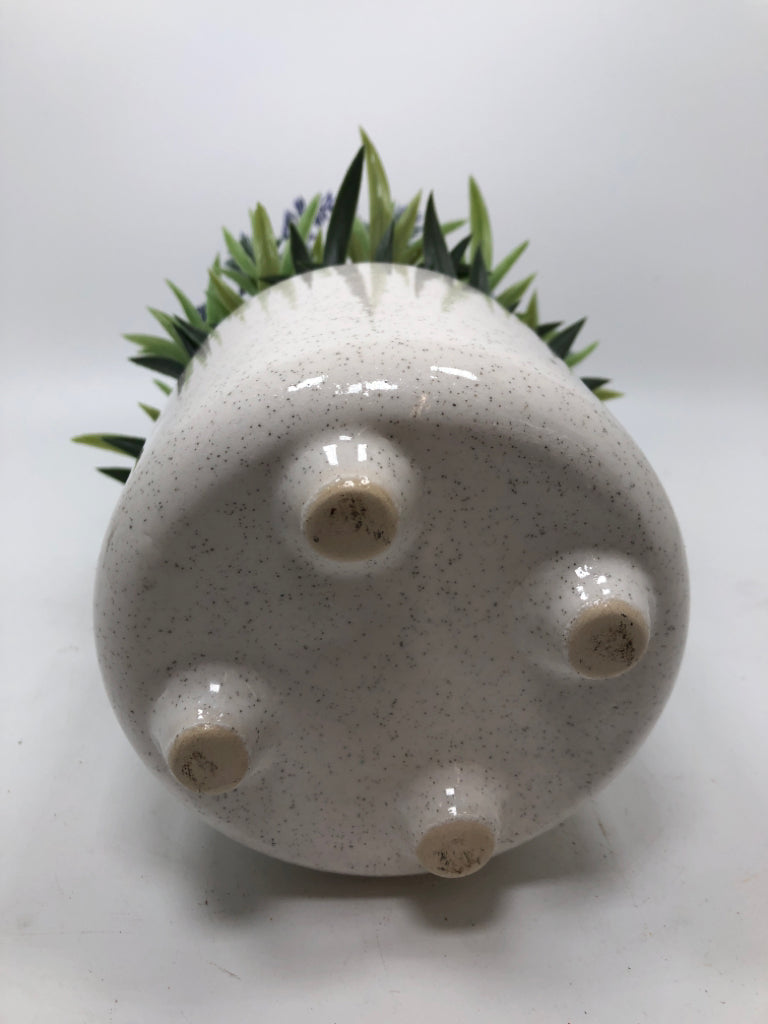 FAUX LAVENDER IN SPECKLED WHITE POT.