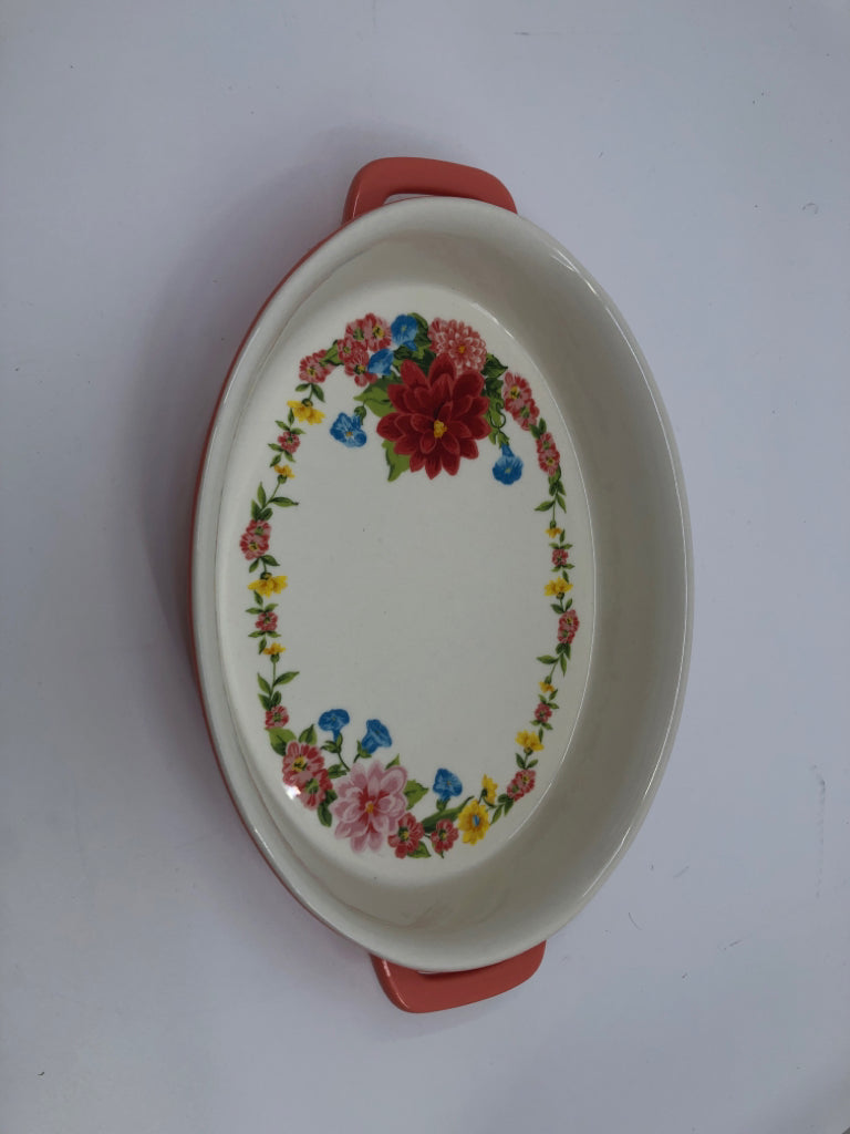 OVAL SALMON PINK FLORAL BAKING DISH W HANDLES.