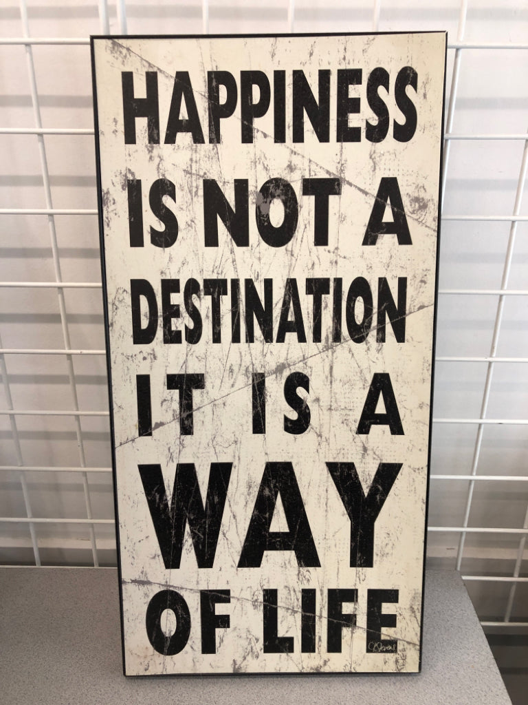 "HAPPINESS IS NOT A" SIGN IN BLACK FRAME WALL HANGING.
