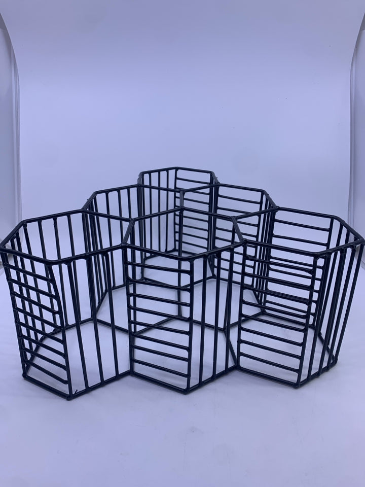 BLACK METAL OCTAGON SHAPED WINE RACK.