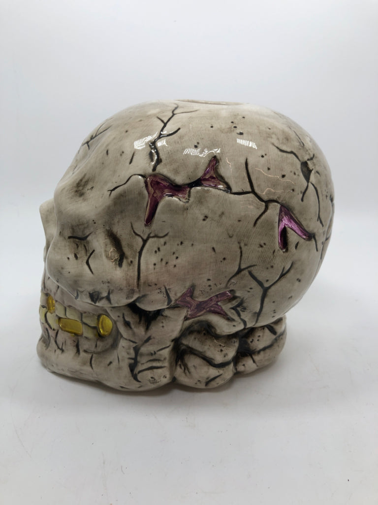 CERAMIC CRACKLE SKULL CANDLE HOLDER.